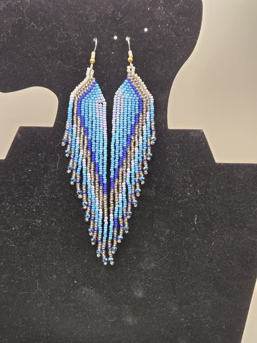 Blue, black, silver, and white handmade beaded feather earrings