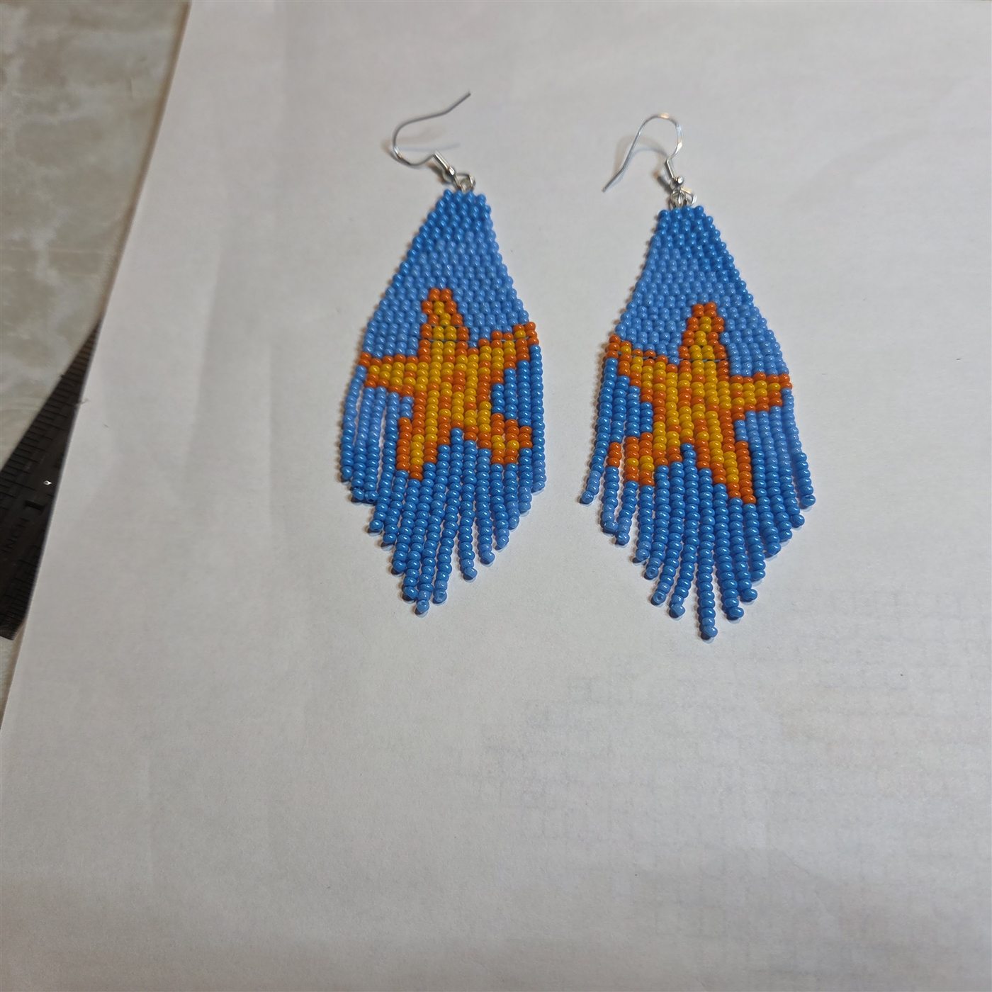 Blue and orange handmade beaded leaf earrings